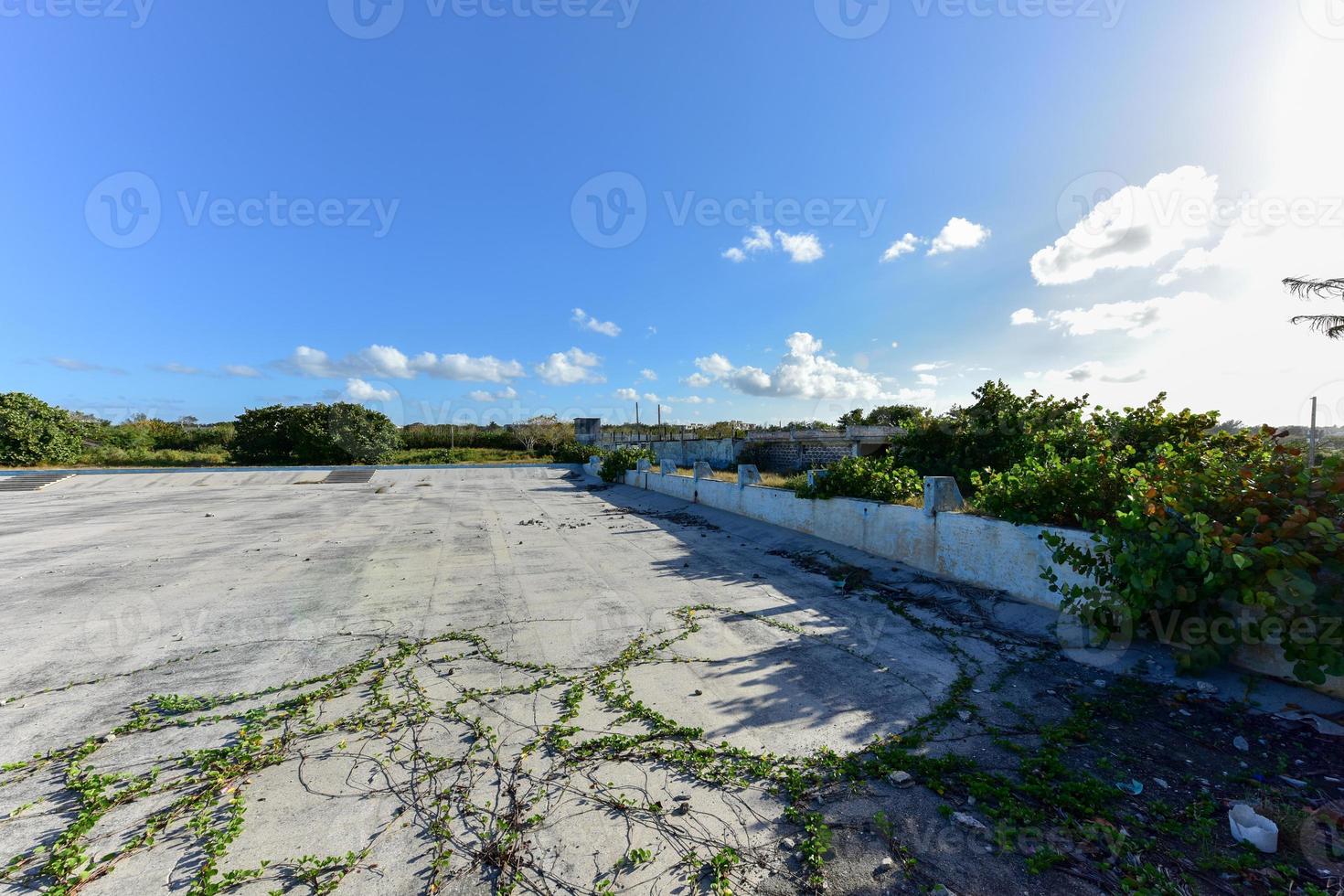 Old abandoned pool in Alamar, a district in the eastern part of Havana in Cuba. This district is primarily prefabrication construction of Soviet-style architecture. photo