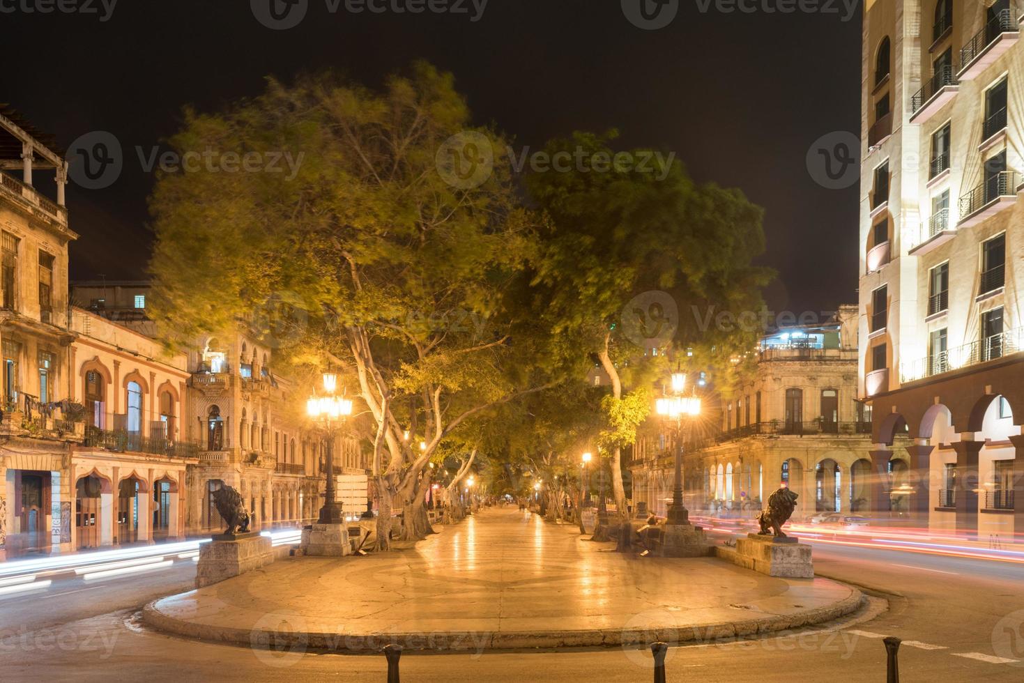 The wide boulevard Paseo del Prado in Havana, Cuba at night. photo