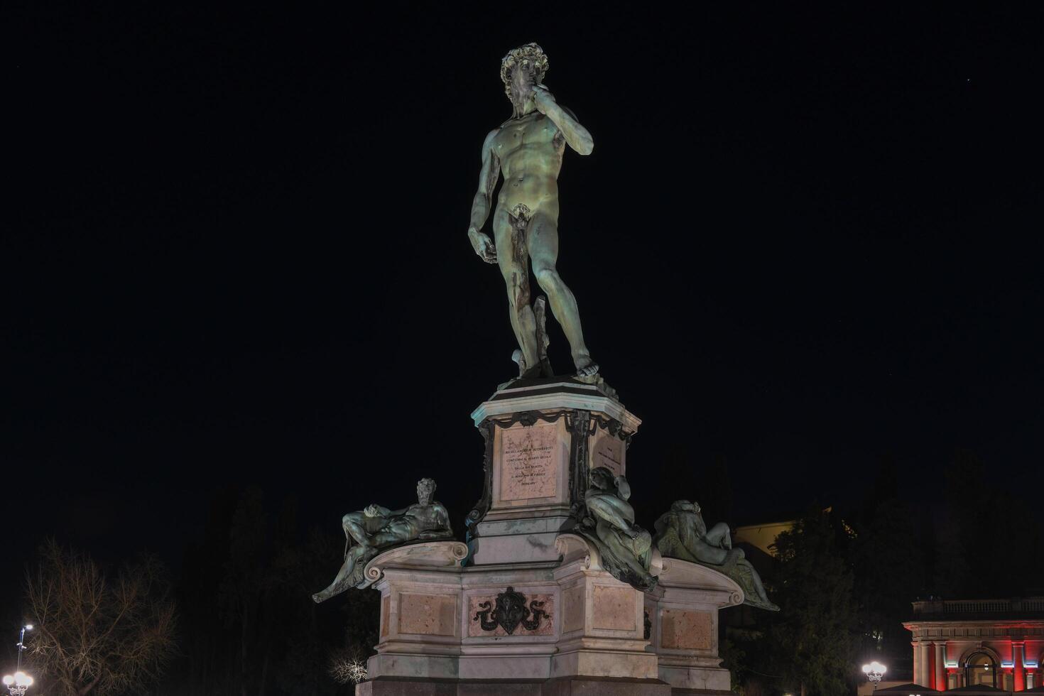 Bronze Statue of David at Michelangelo Park in Florence, Italy at night photo