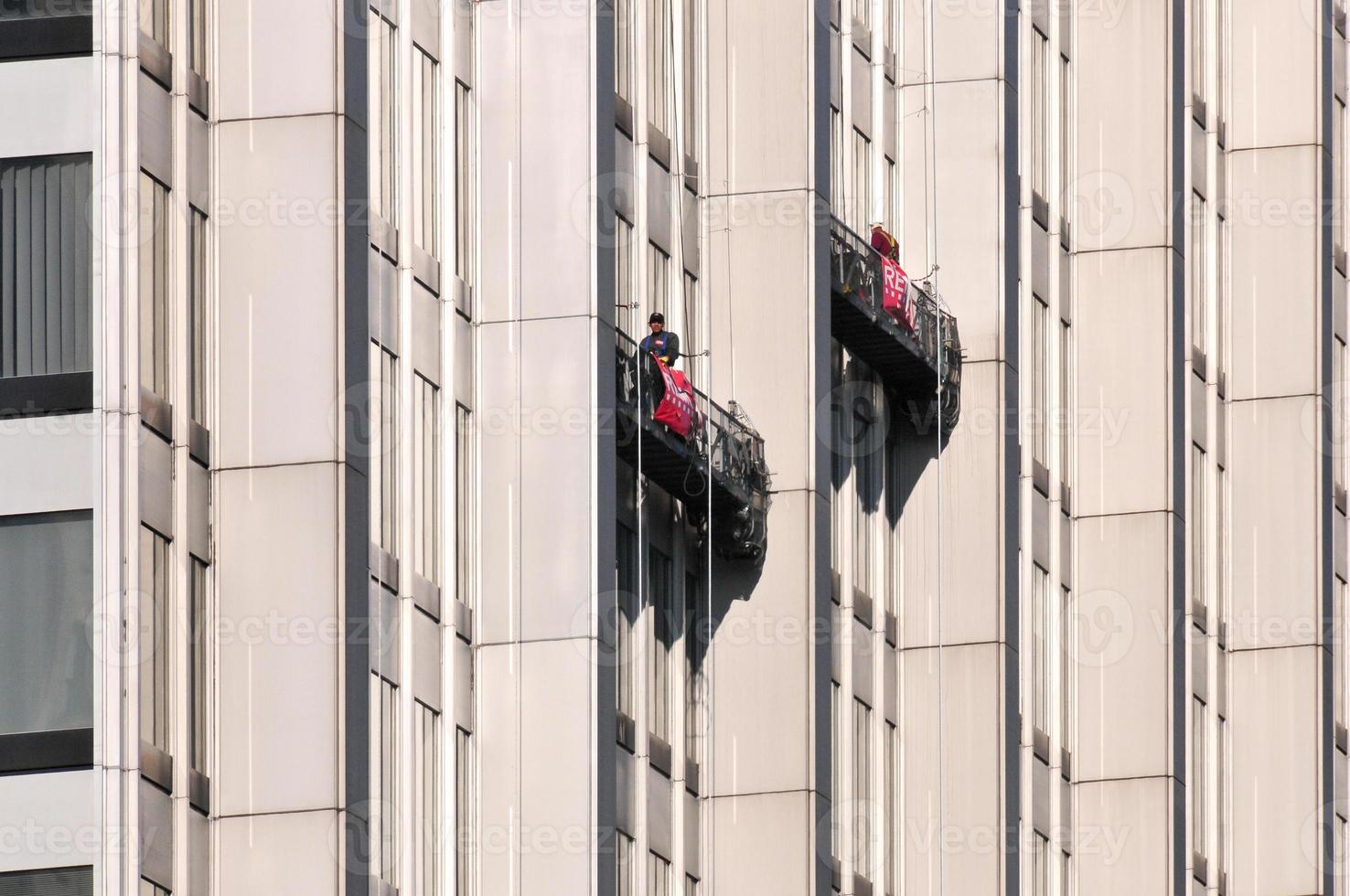 Window washer in an office tower in downtown Manhattan in New York City photo