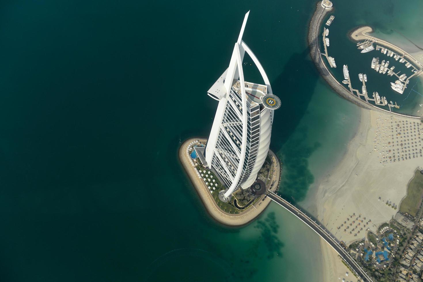 Dubai, UAE - November 25, 2012 -  View of the luxury beach of Dubai and Burj al-Arab, in Dubai,UAE. The Bur is the most exclusive hotel of the world, and seven star in Dubai. photo