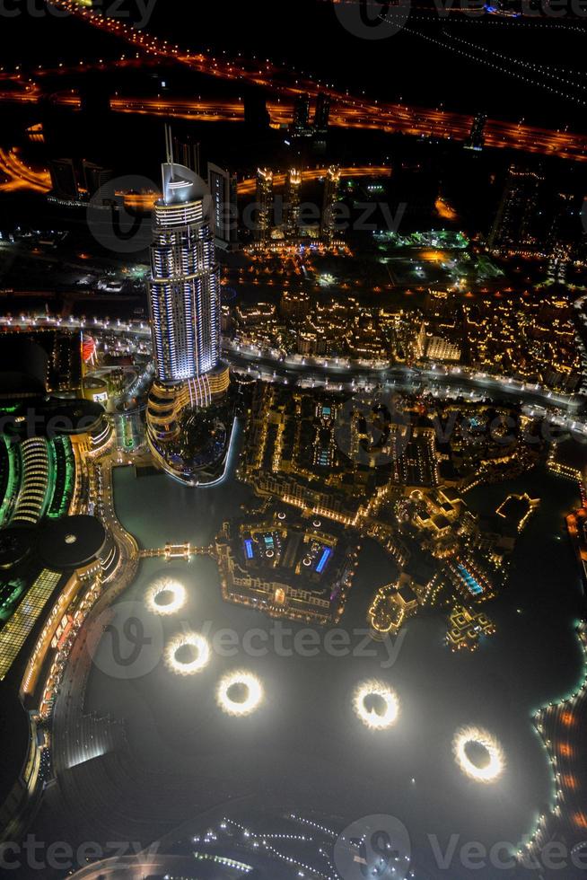 Aerial view of the skyline in Dubai, United Arab Emirates at night photo