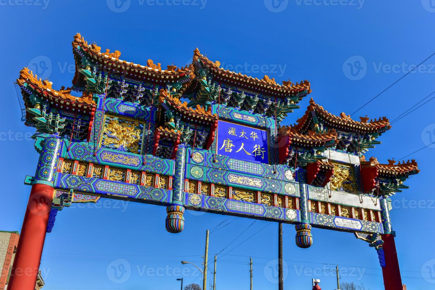 The royal imperial arch in Ottawa, Canada. It marks the entrance of the Chinatown area in Ottawa. Rich in symbolism, the center blue panel on the arch is Chinese characters saying Ottawa Chinatown. photo