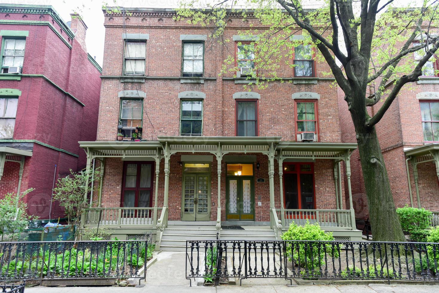 House on Astor Row. Astor Row is the name given to 28 row houses on the south side of West 130th Street, between Fifth and Lenox Avenues in the Harlem neighborhood of Manhattan, New York City photo