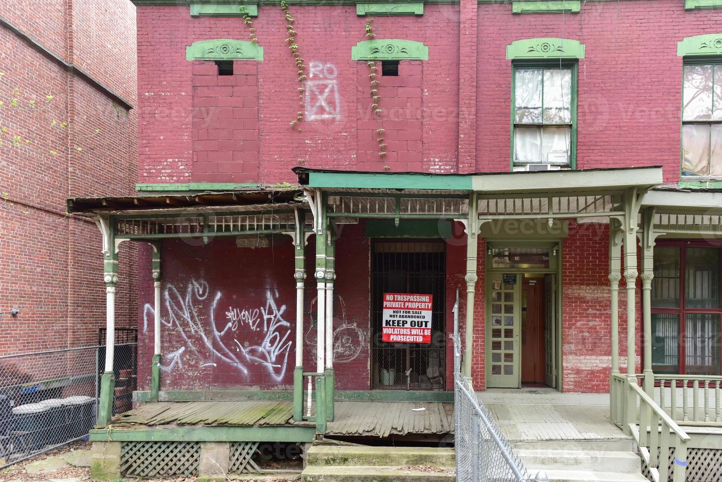 House on Astor Row. Astor Row is the name given to 28 row houses on the south side of West 130th Street, between Fifth and Lenox Avenues in the Harlem neighborhood of Manhattan, New York City photo