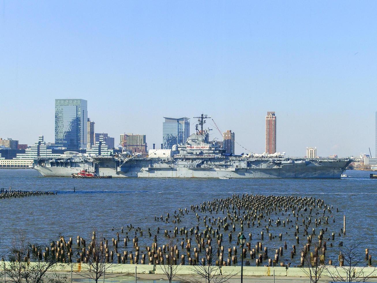 New York City - November 5, 2006 -  USS Intrepid in the Hudson River as it is towed for repairs in New York City. photo