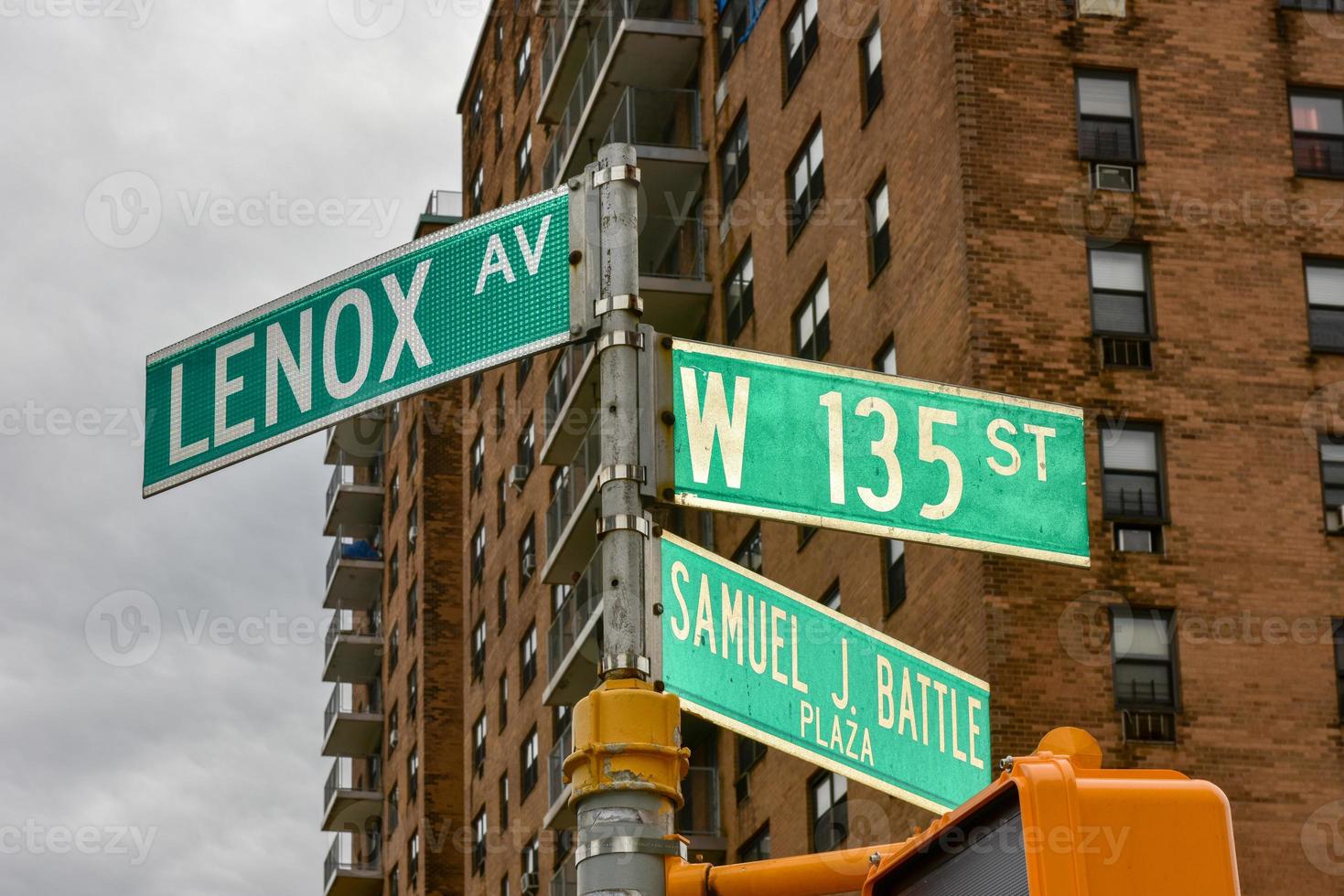 Harlem street intersection at Lenox Avenue and West 135 st in Manhattan, New York City. photo