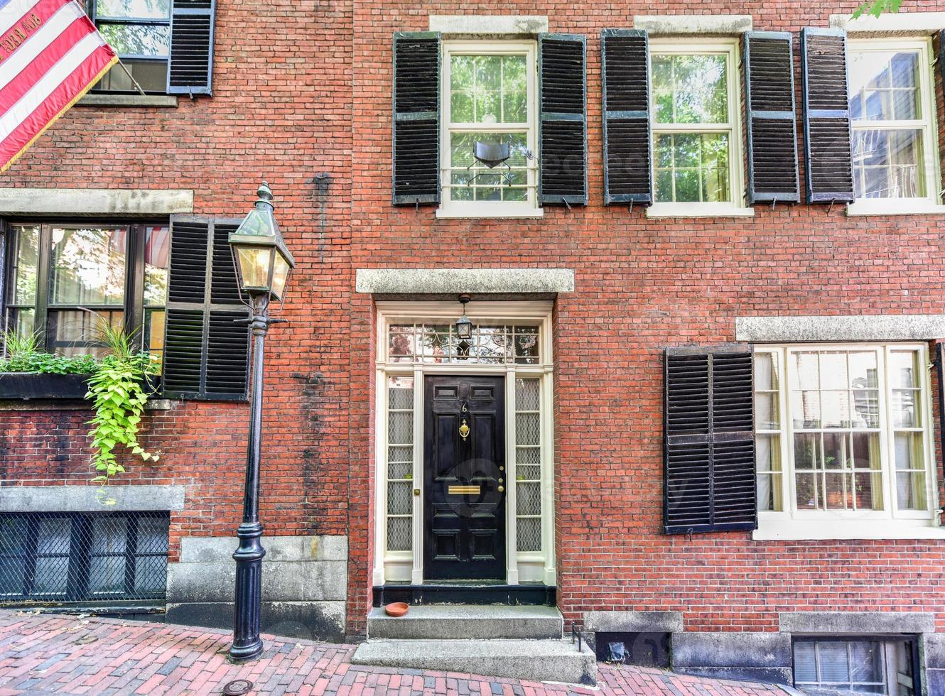 Acorn Street in Boston, Massachusetts. It is a narrow lane paved with cobblestones that was home to coachmen employed by families in Mt. Vernon and Chestnut Street mansions. photo