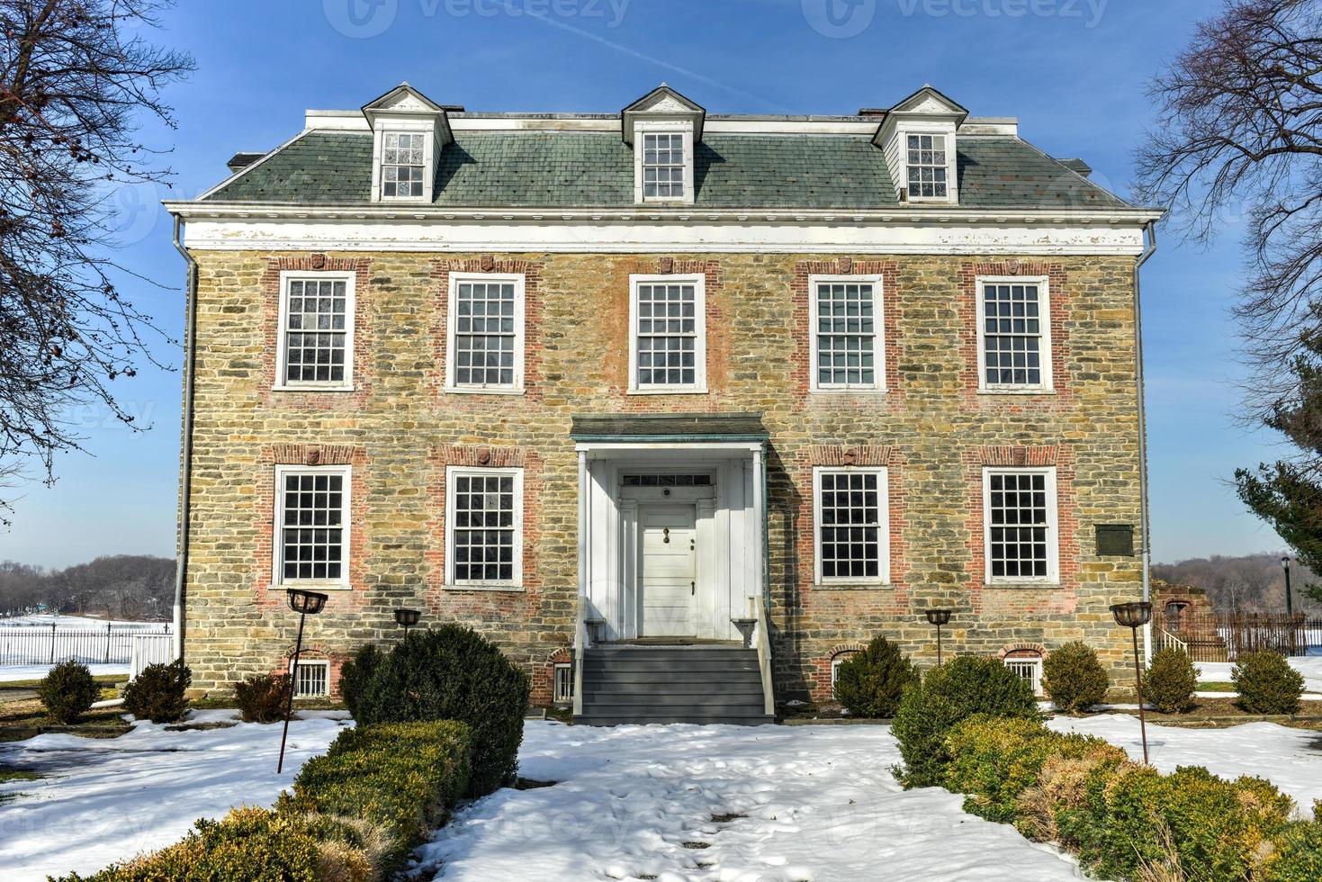 Historic Georgian 1748 Van Cortlandt Manor House built in dressed fieldstone with a double-hipped roof in Bronx, New York photo