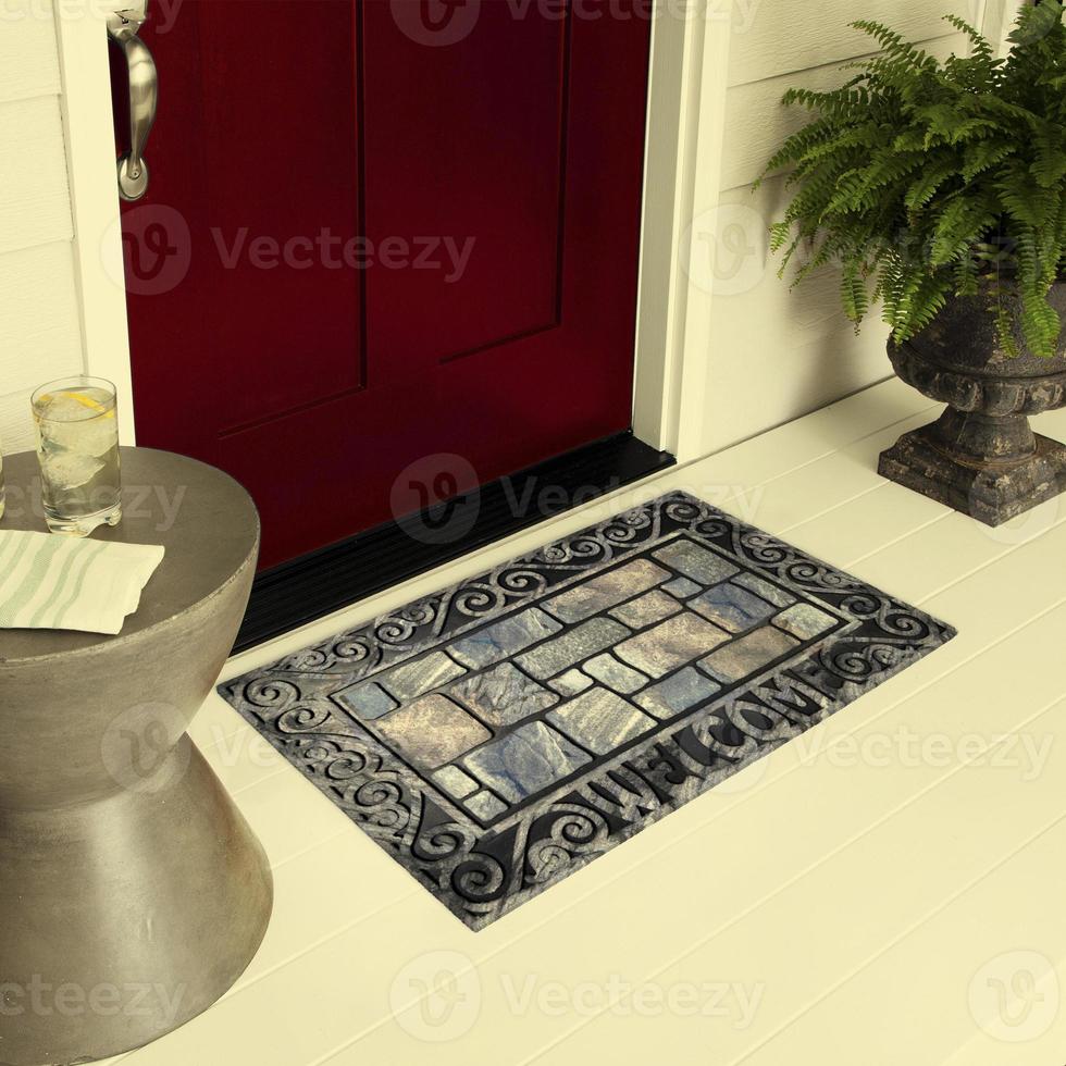 Designer Welcome Entry Doormat Placed on Floor Outside Entry Door with Plants and lemon ice drink photo