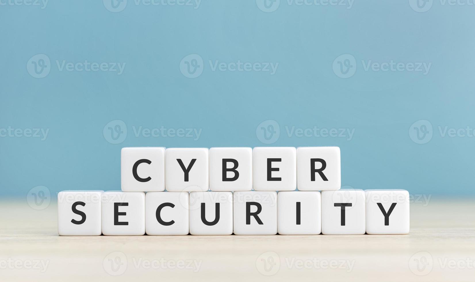 Cyber security concept. Text on cube blocks on blue background. Copy space photo