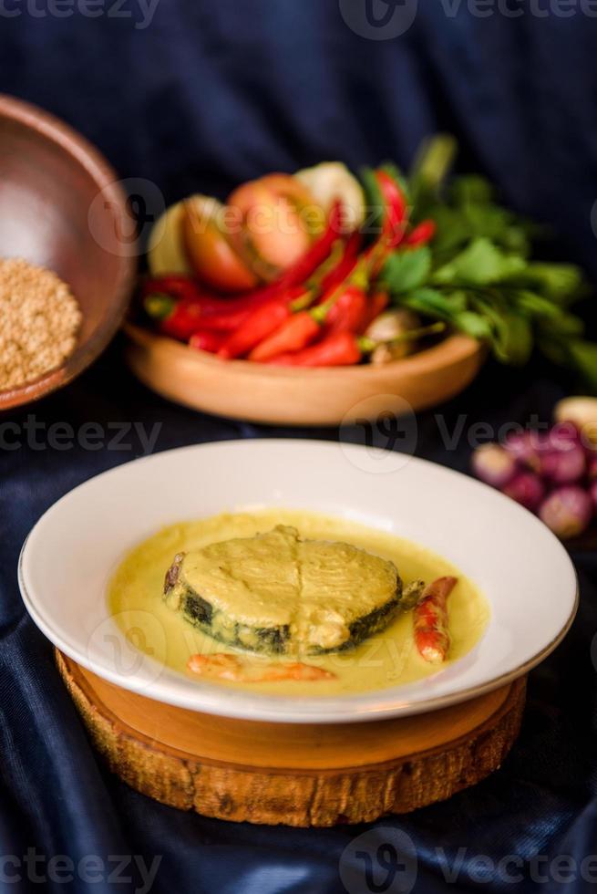 Fish in spicy curry sauce photo