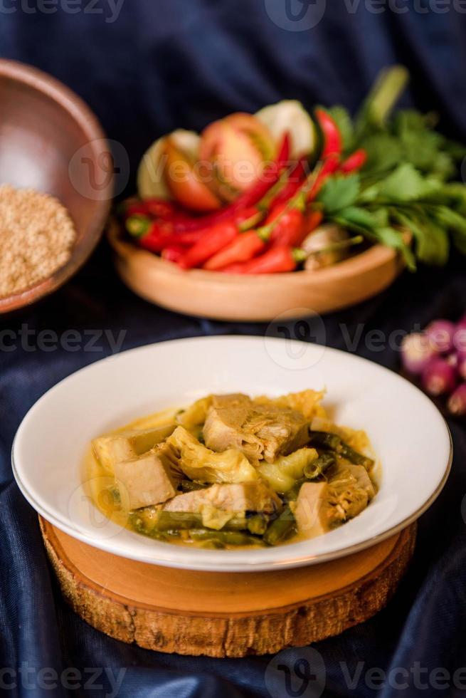 Sayur nangka is Indonesian vegetables soup made from young jackfruits cook with herbs and coconut milk photo