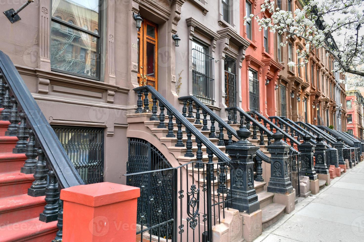 View of Brownstone buildings in Harlem in Manhattan, New York City. photo