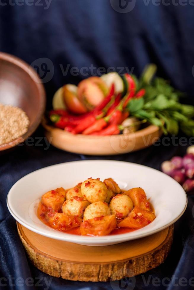 eggs with red chili sauce on dish. balado eggs. indonesia food photo
