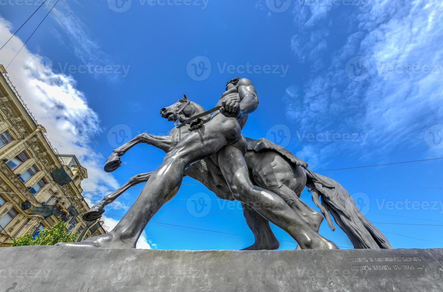 Horse Tamer sculpture of the 19th century on the Anichkov Bridge in St. Petersburg Attraction, Russia. photo