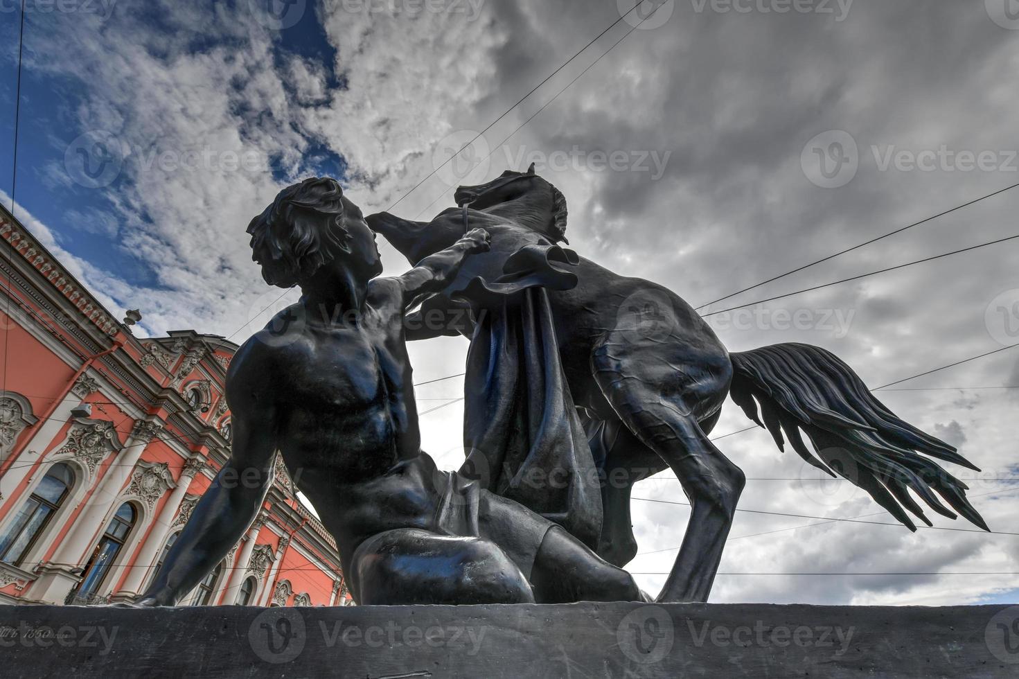 Horse Tamer sculpture of the 19th century on the Anichkov Bridge in St. Petersburg Attraction, Russia. photo