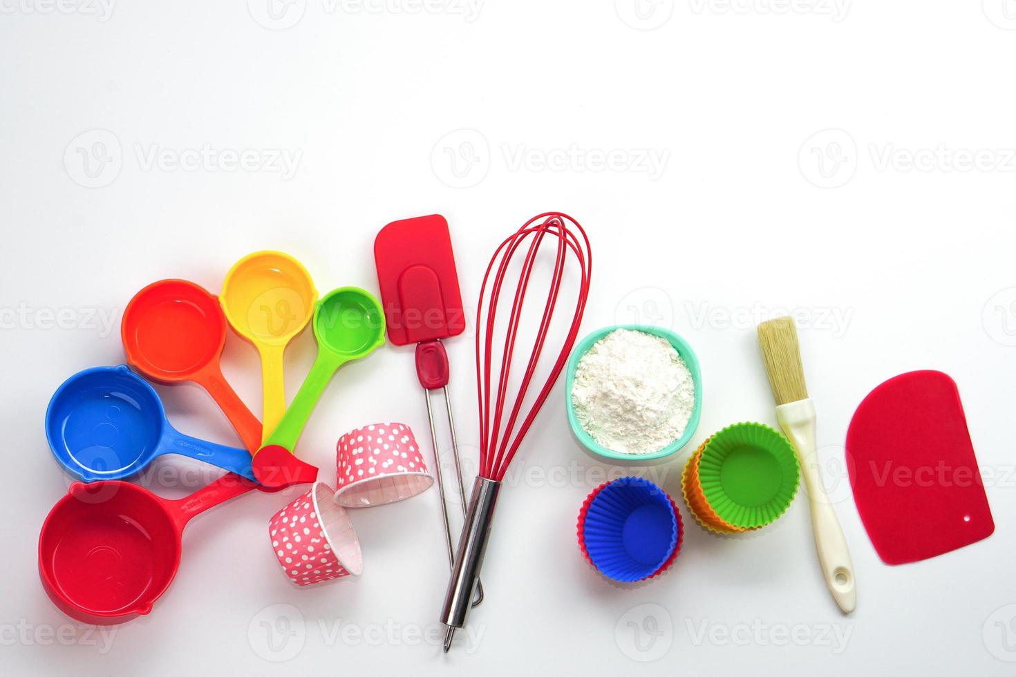 Top view set of kitchen utensils and ingredients for bakery on white background. Materials or kitchen equipment for bakery. photo