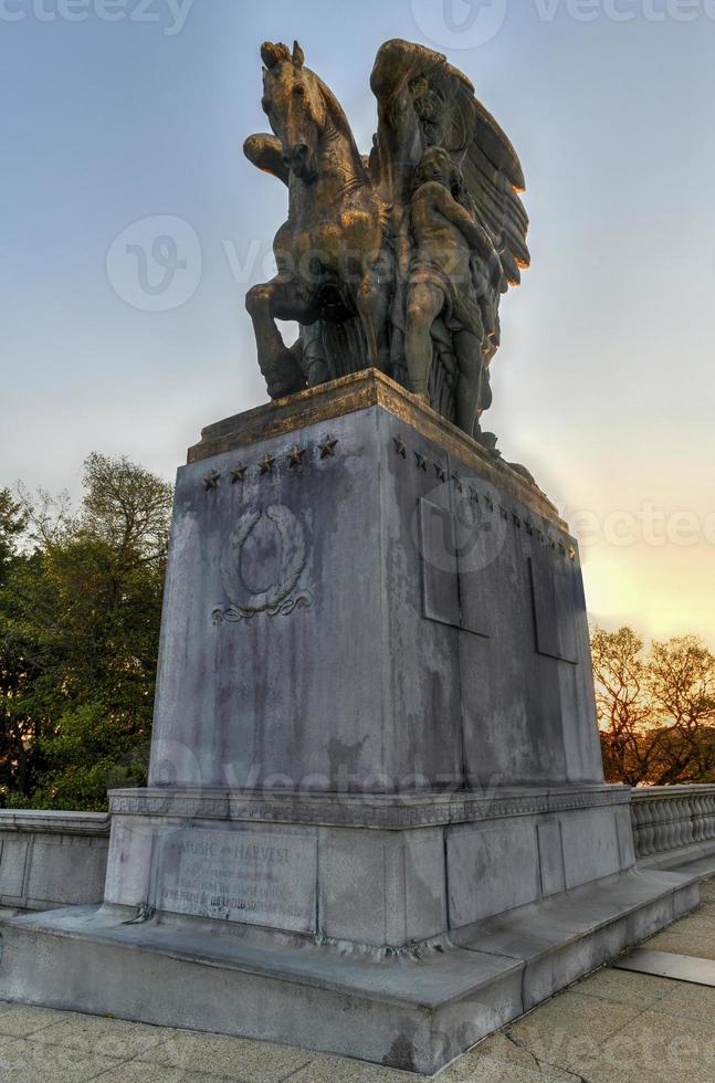 Arts of Peace, bronze, fire-gilded statue groups on Lincoln Memorial Circle in West Potomac Park at sunset in Washington, DC photo