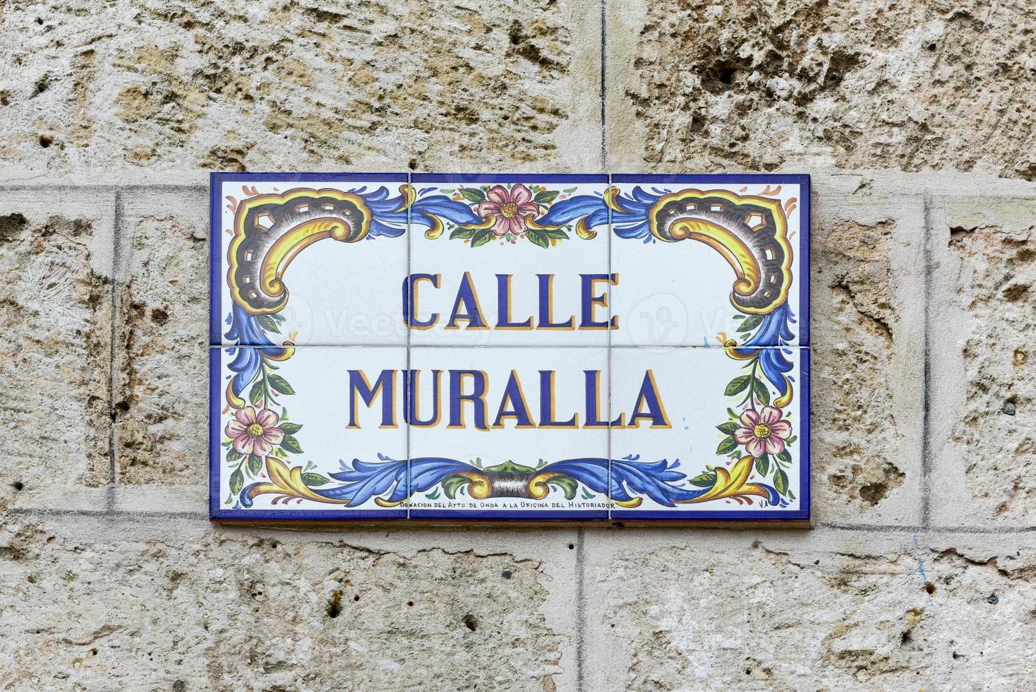 Sign for Calle Muralla in Plaza Vieja in Old Havana, Cuba. photo