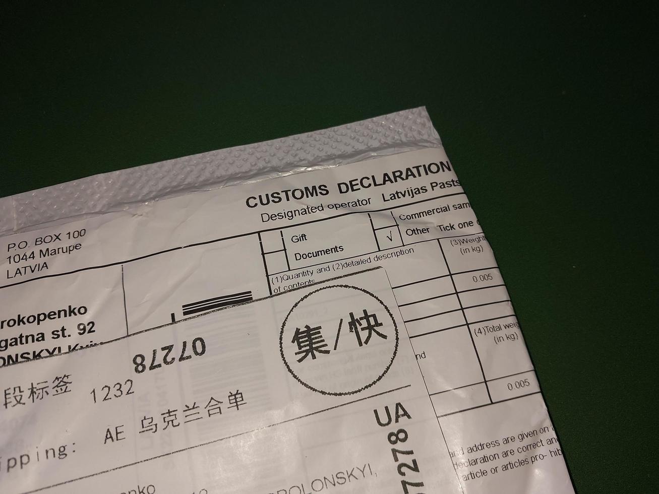 KIEV, UKRAINE - DECEMBER 28, 2022 Envelopes arrived by parcel from China photo