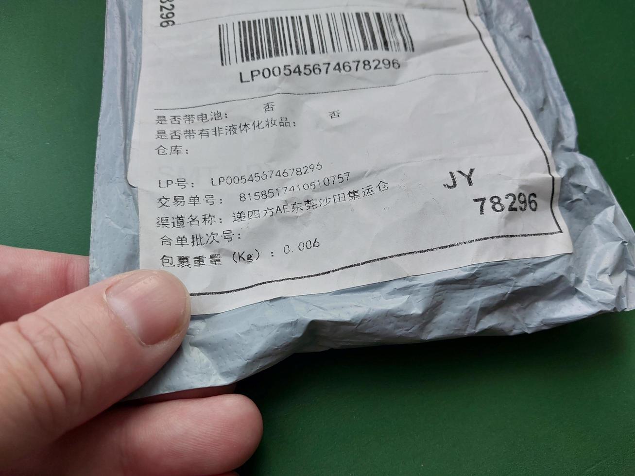 KIEV, UKRAINE - DECEMBER 28, 2022 Envelopes arrived by parcel from China photo