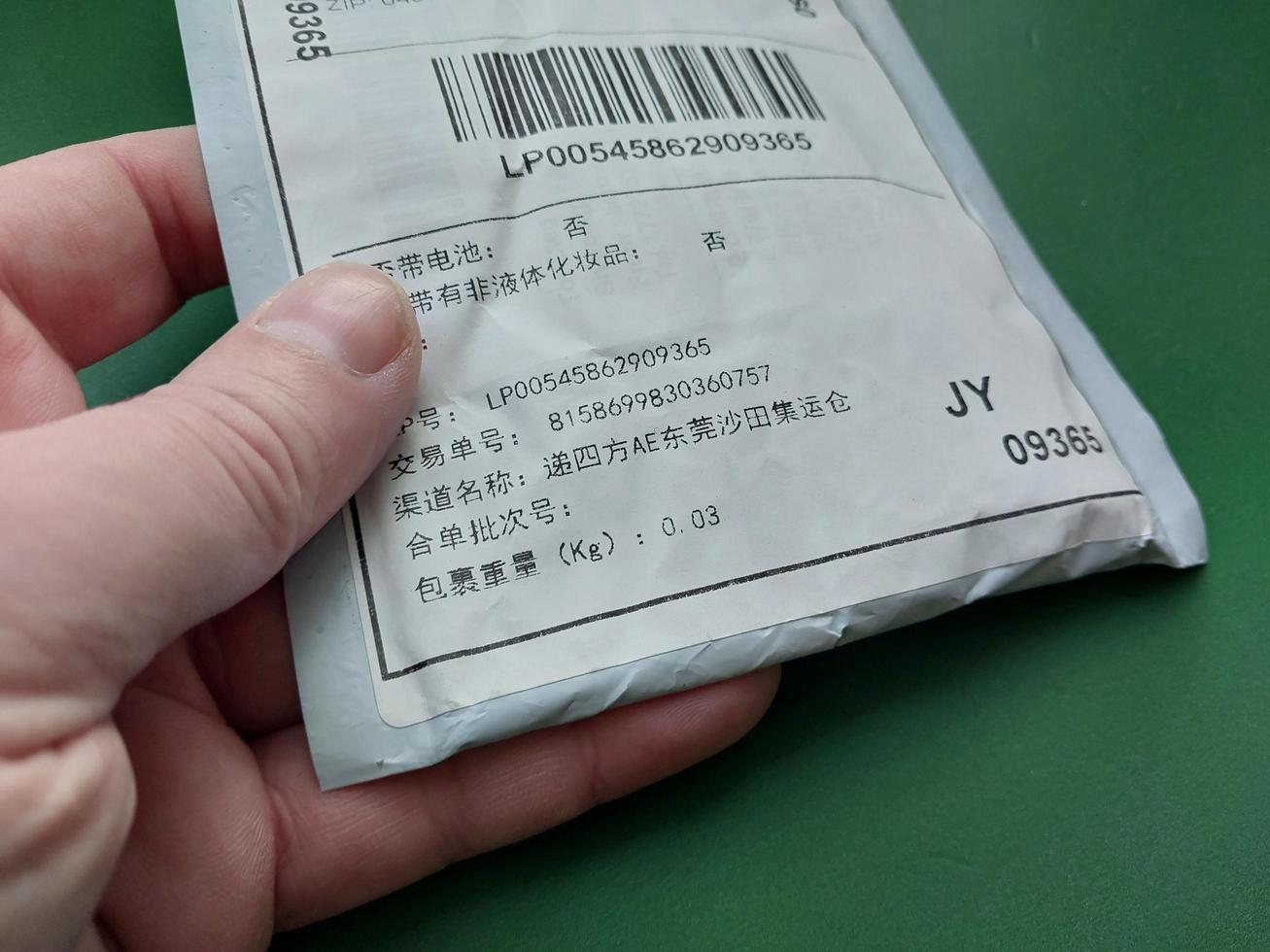 KIEV, UKRAINE - DECEMBER 28, 2022 Envelopes arrived by parcel from China photo