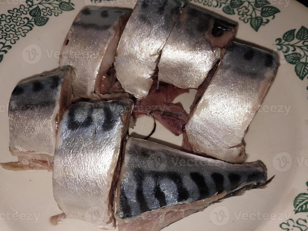 Sea fish mackerel on the table photo