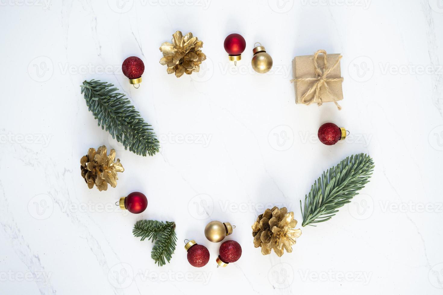 Mockup for a letter or a Christmas invitation with gold fir cone photo