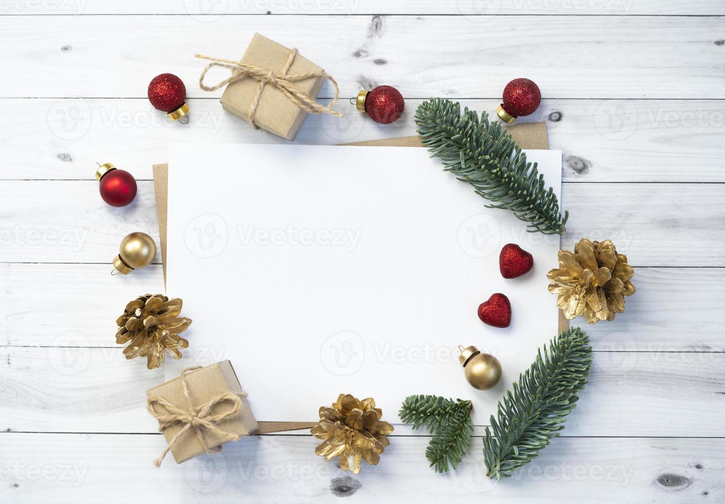 Mockup for a letter or a Christmas invitation with gold fir cone photo