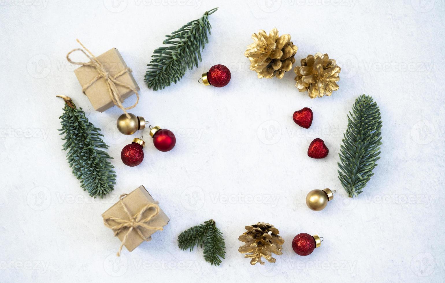 Mockup for a letter or a Christmas invitation with gold fir cone photo