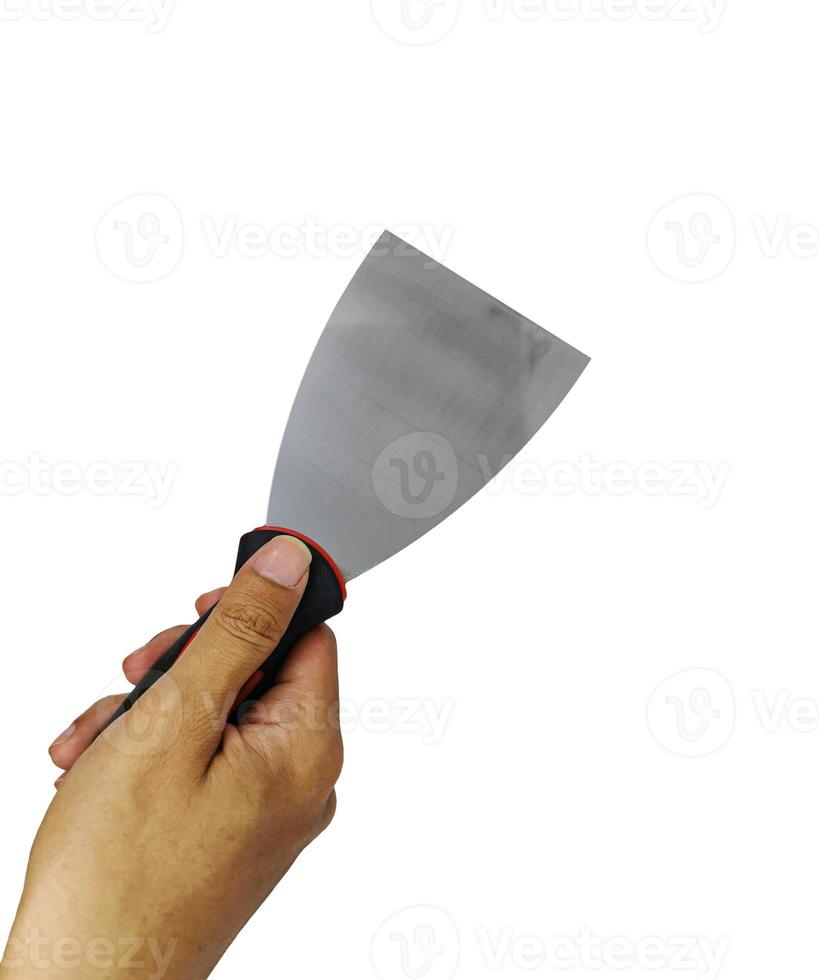Hand holding a metallic putty knife on white background. A new putty knife with right hand in closeup photo