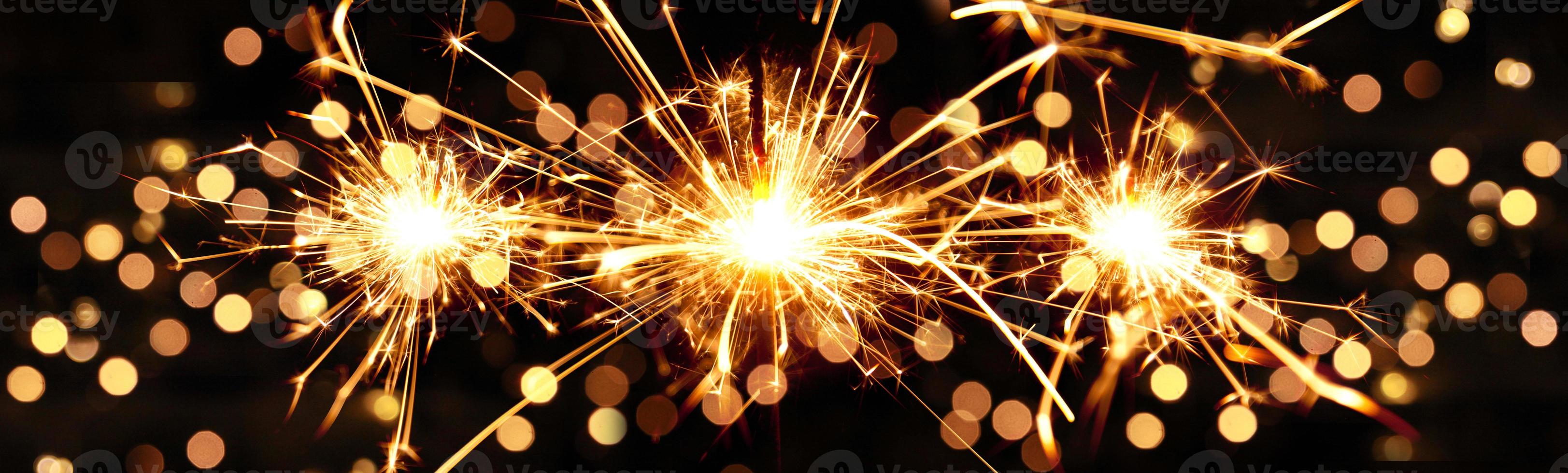 Happy New Year background with glowing sparklers. 16655507 Stock Photo