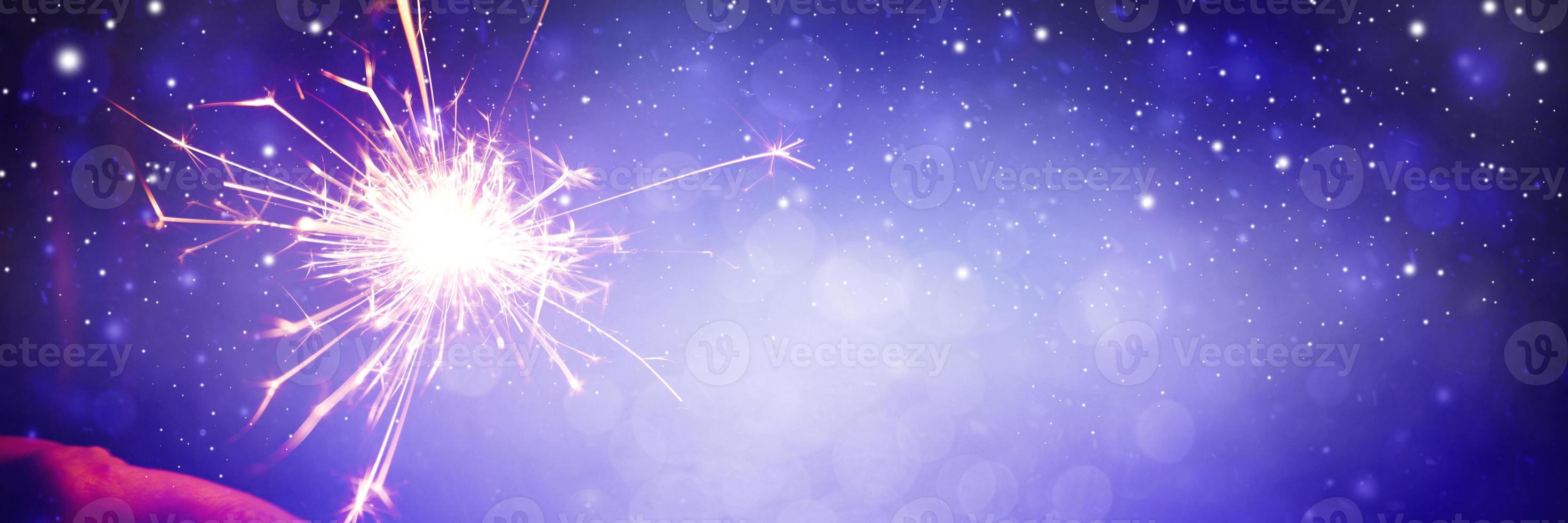 Happy New Year background with glowing sparklers. 16655553 Stock Photo