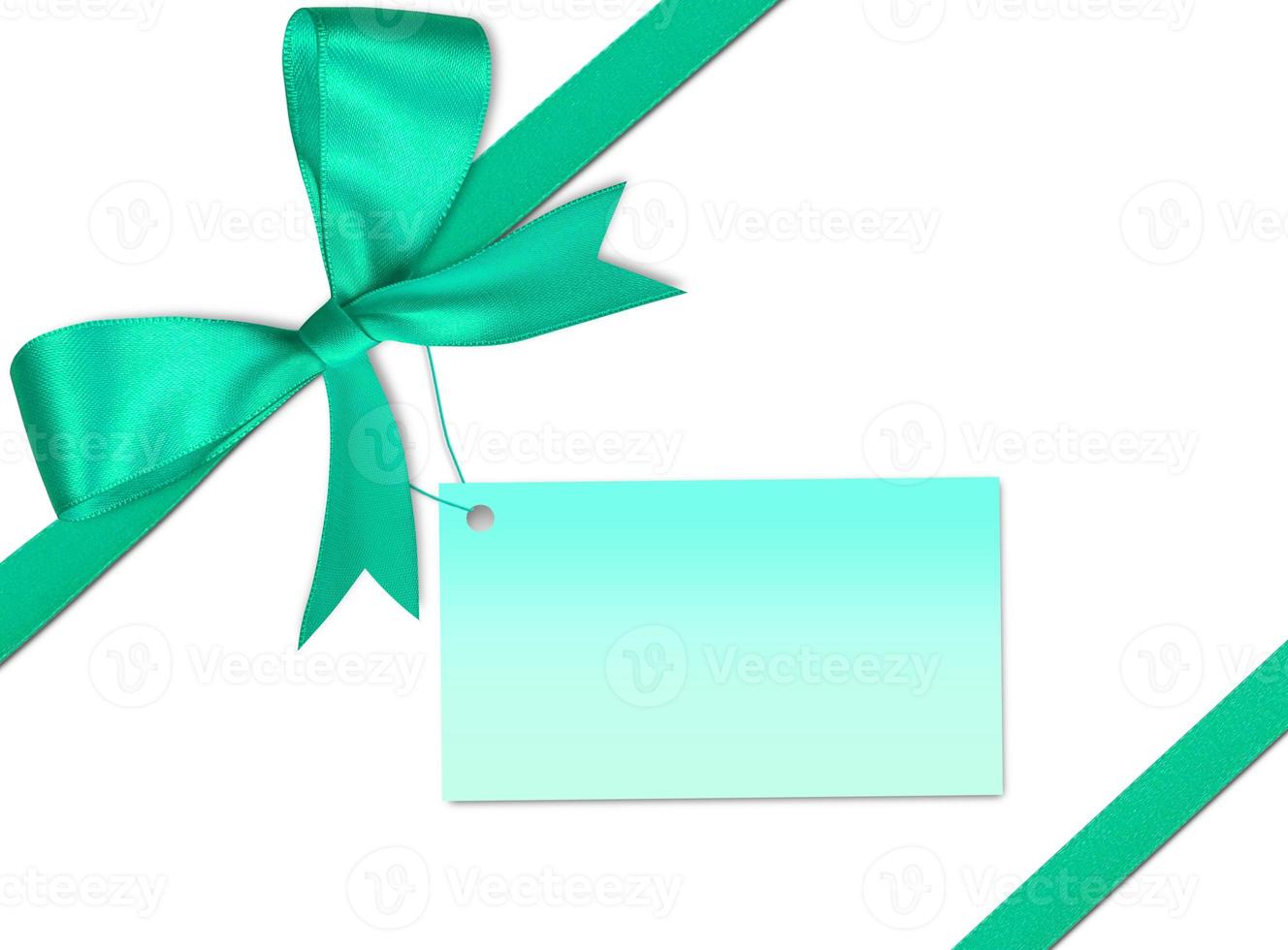 Gift card note with ribbon on isolated background photo