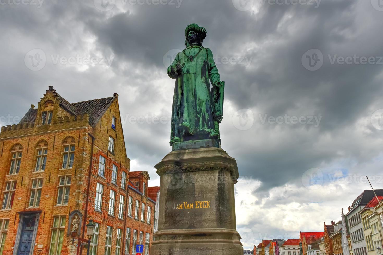 Statue of the Flemish painter Jan van Eyck in Bruges, Belgium photo