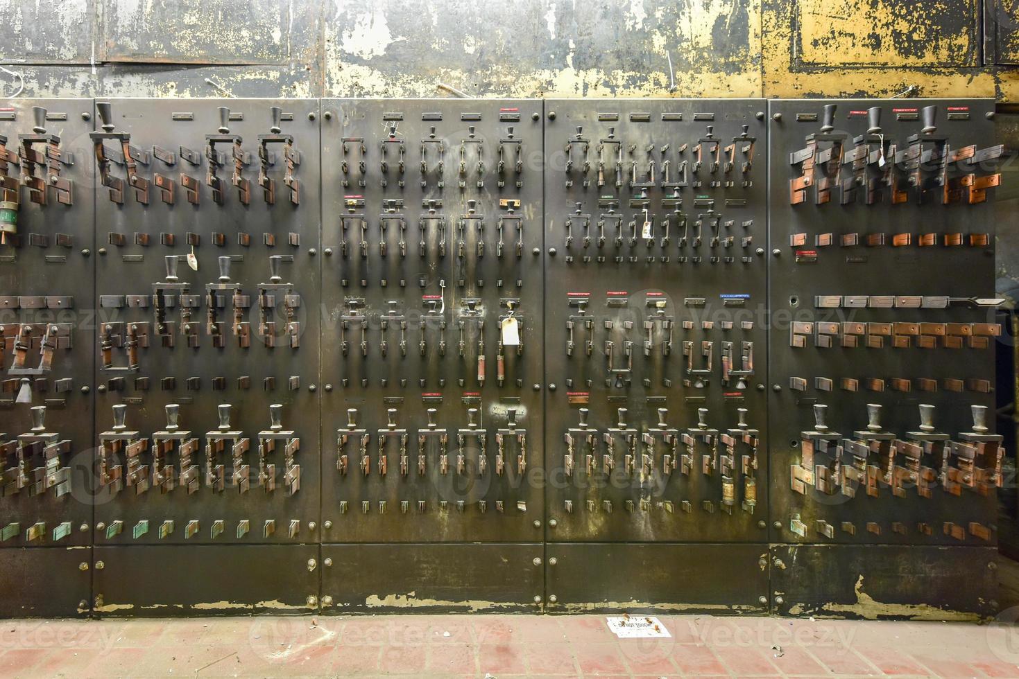 Vintage electrical breakers, fuses, handles and meters. photo