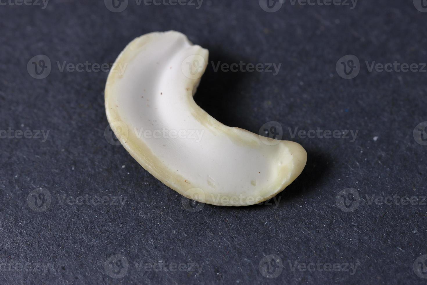 Cashew nuts on a back background. Group of cashew nuts on back background photo