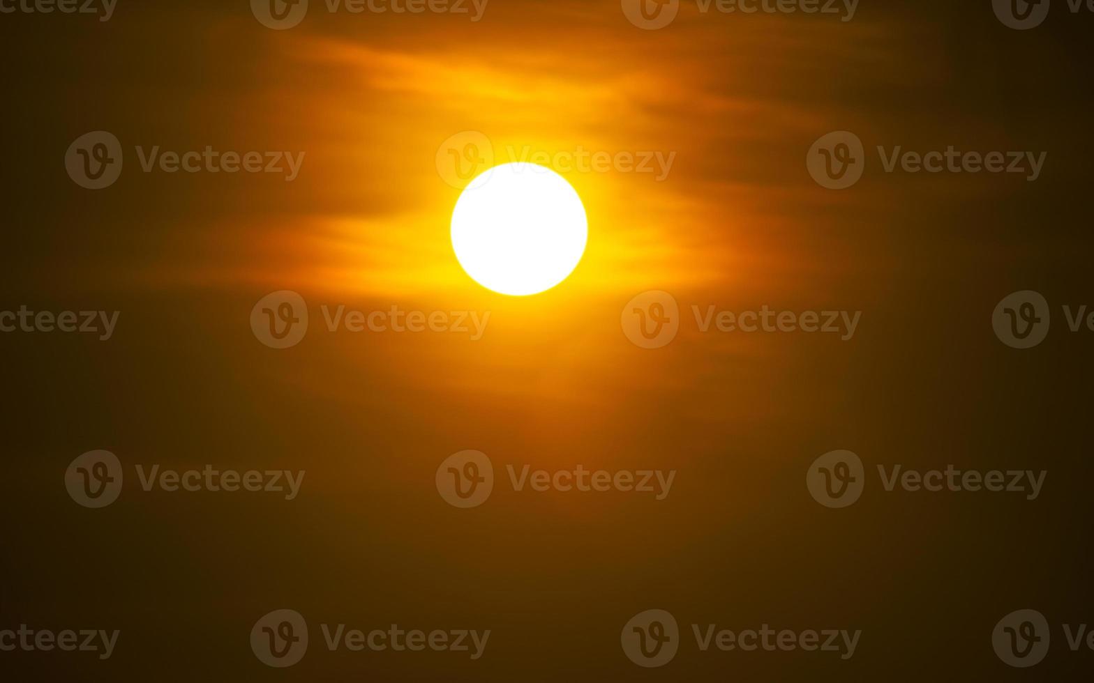 The sun at sundown. Sunset sky background photo