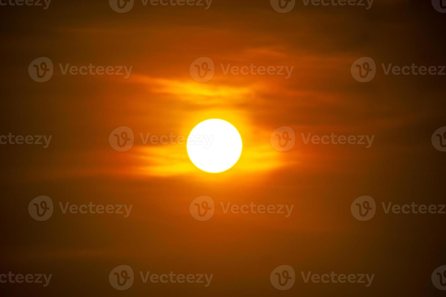 The sun at sundown. Sunset sky background photo