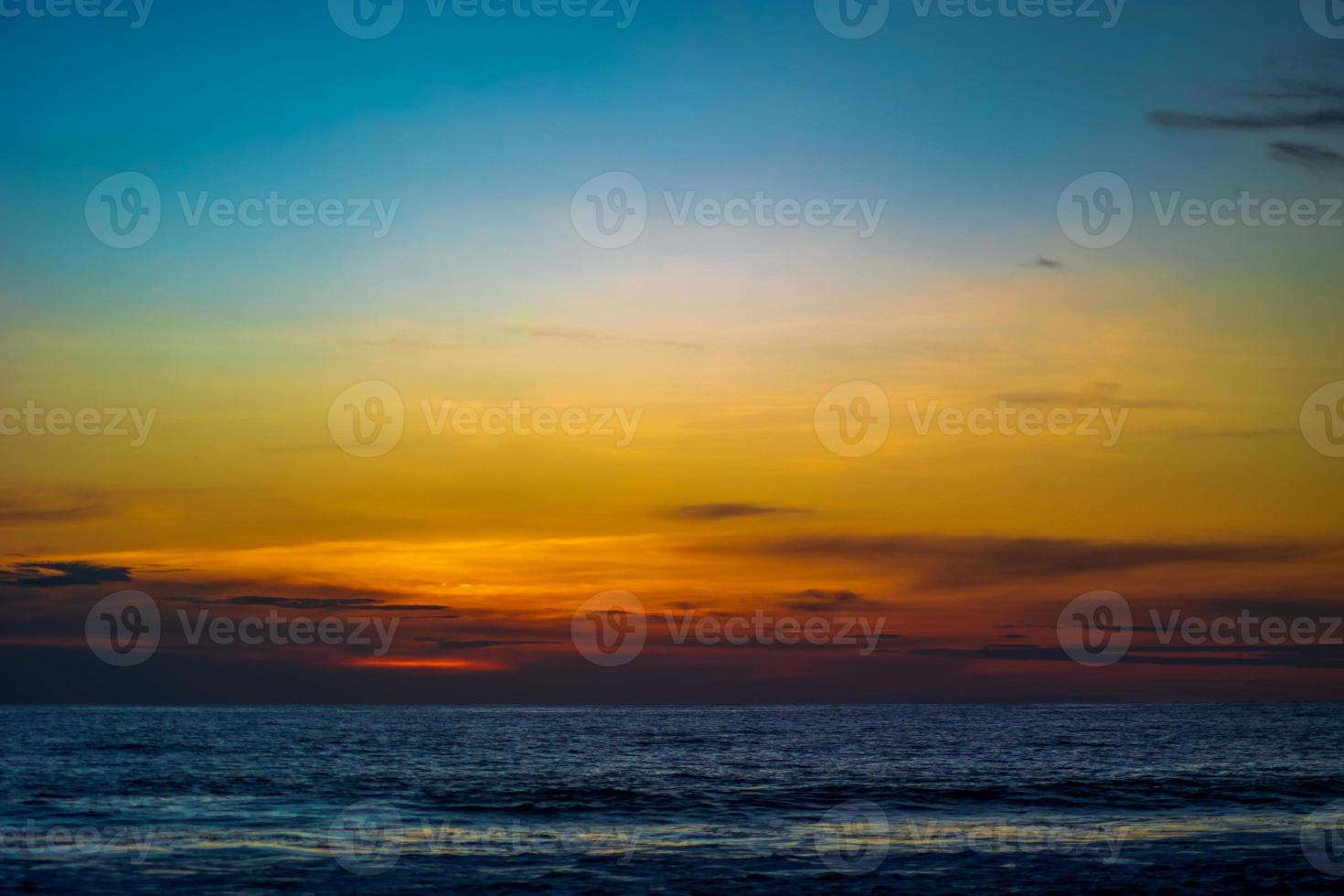 Sunset over the sea with colorful sky photo