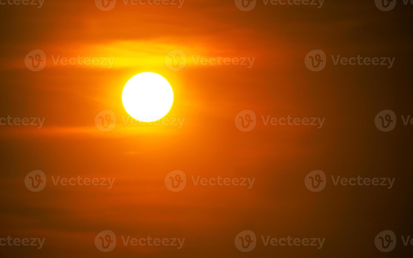 The sun at sundown. Sunset sky background photo