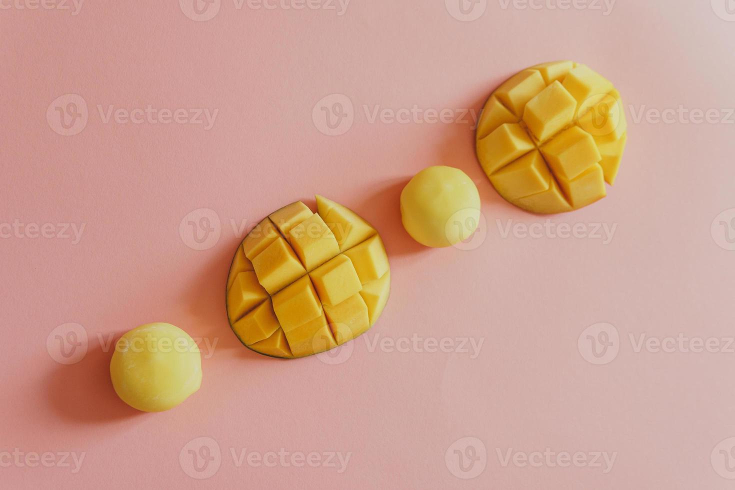 Tasty dessert Mochi with mango fruit on pink background photo