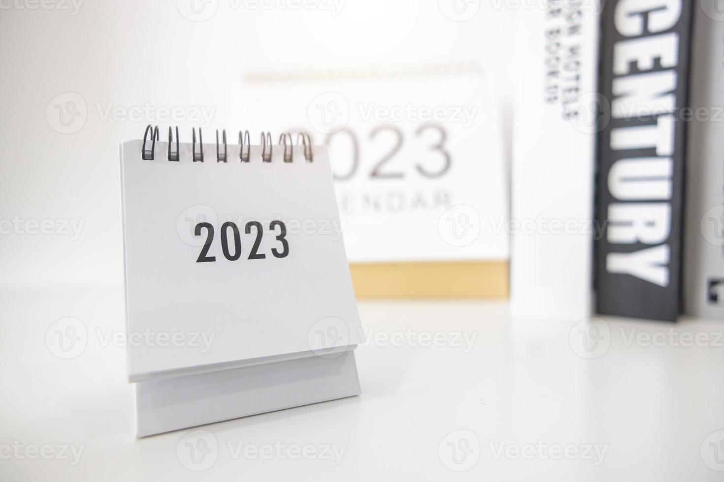 2023 business calendar on office table in new year day. Make a work plan for the start of the year. Concept about Celebration, Business, Christmas, New Year. photo