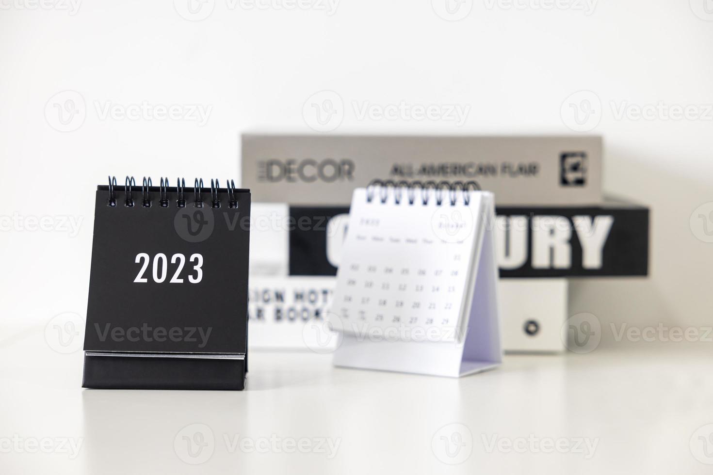 2023 business calendar on office table in new year day. Make a work plan for the start of the year. Concept about Celebration, Business, Christmas, New Year. photo