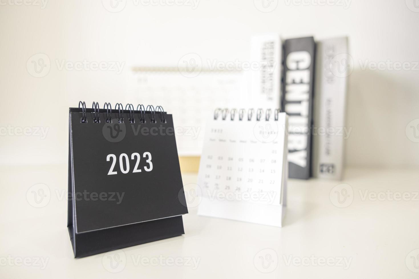 2023 business calendar on office table in new year day. Make a work plan for the start of the year. Concept about Celebration, Business, Christmas, New Year. photo