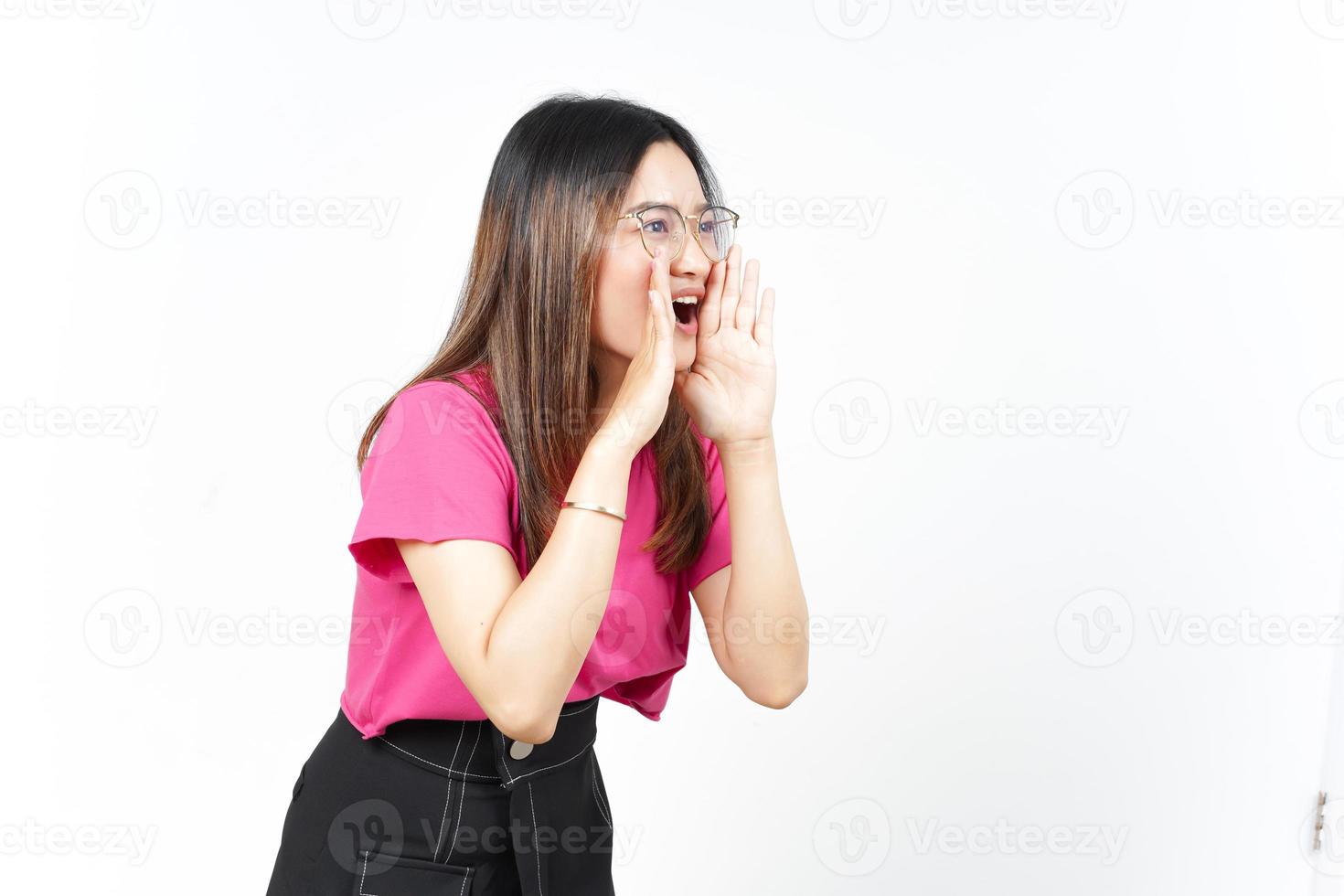 Announcement with hands over mouth Of Beautiful Asian Woman Isolated On White Background photo