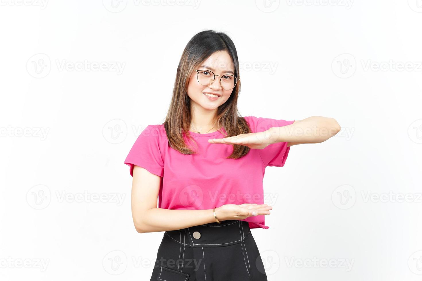 Measuring and Showing Big Sign Product Of Beautiful Asian Woman Isolated On White Background photo
