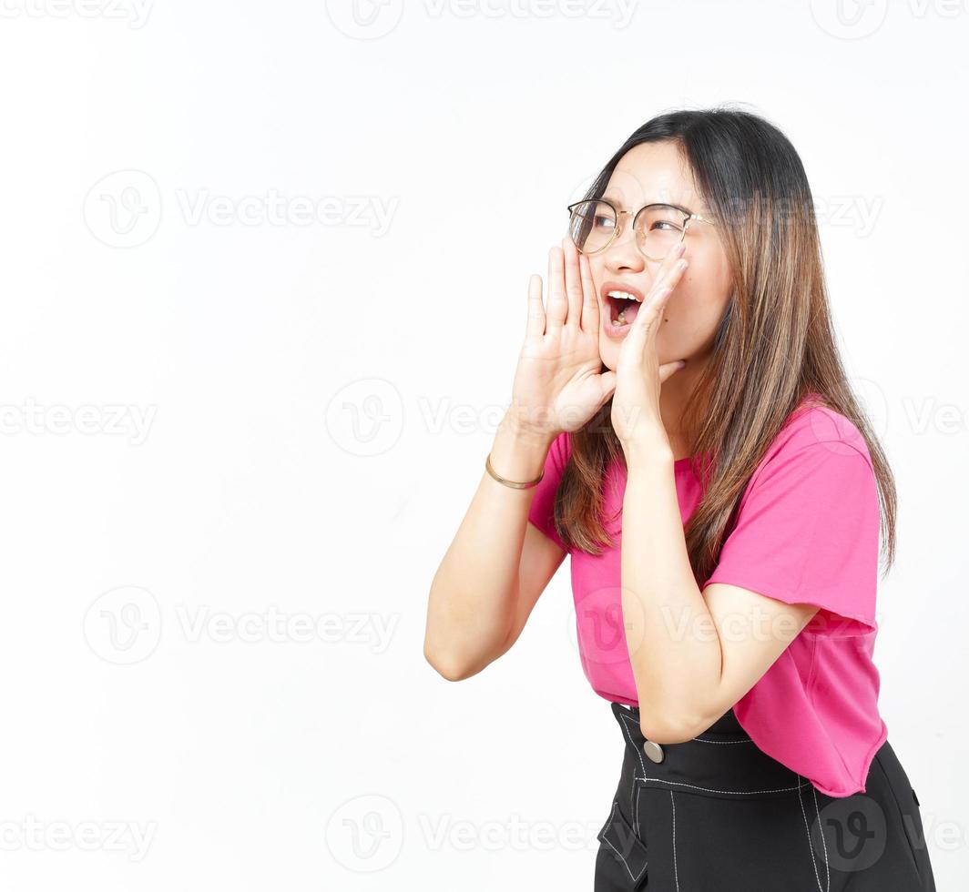 Announcement with hands over mouth Of Beautiful Asian Woman Isolated On White Background photo