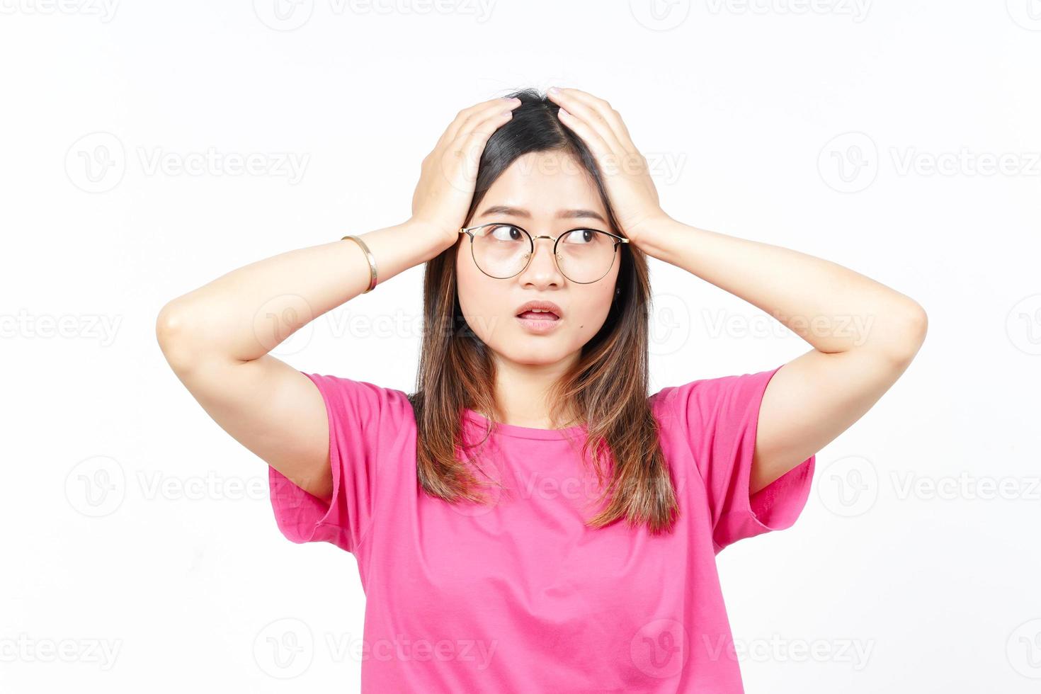 Hands on Head with WOW Face Expression Of Beautiful Asian Woman Isolated On White Background photo